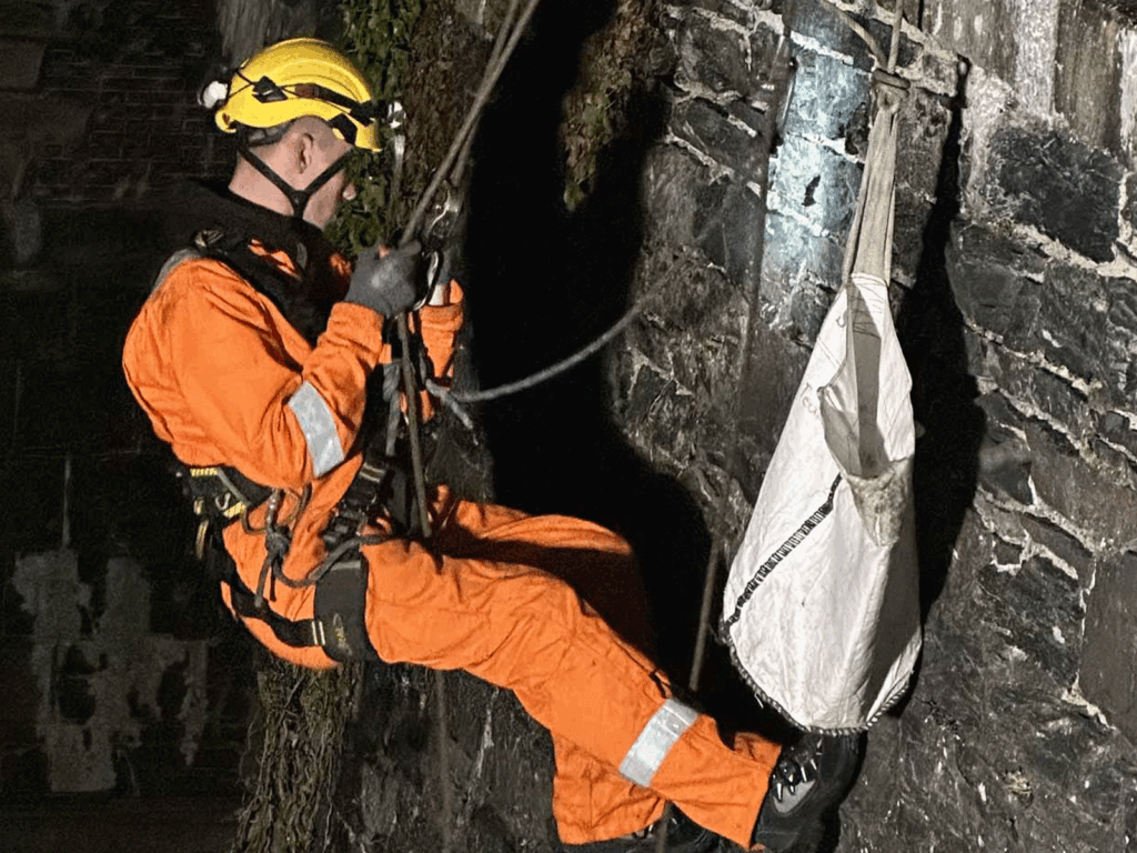 Rope access brickwork repair and pointing on high-level masonry for building maintenance