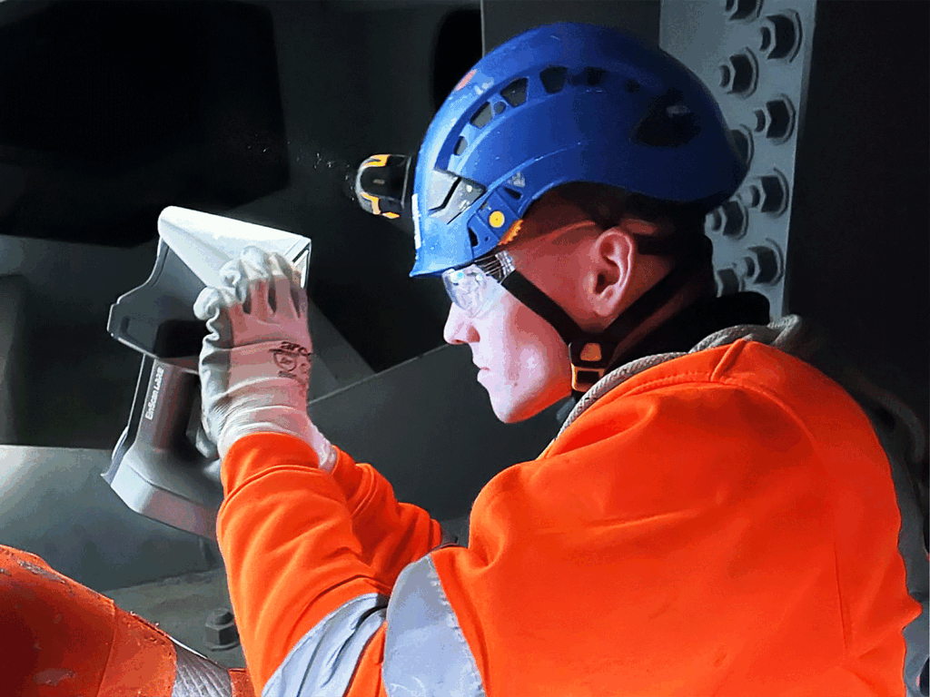 Rope access inspection work on ship hull and superstructure in a harbour environment