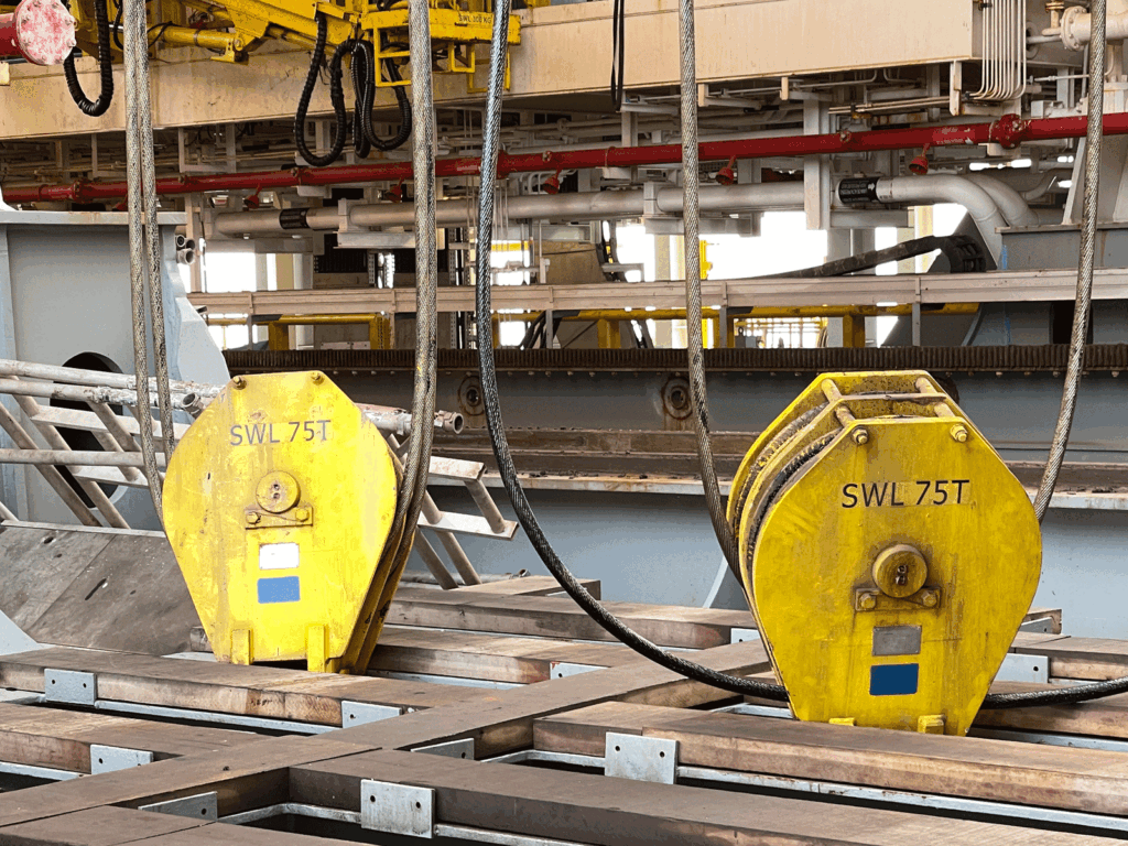 Lifting gear and rigging equipment on a dockside platform during inspection
